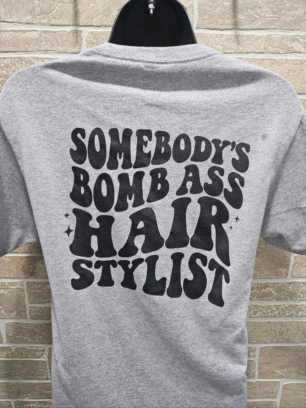 Grey Somebody's Hairstylist Graphic Tee