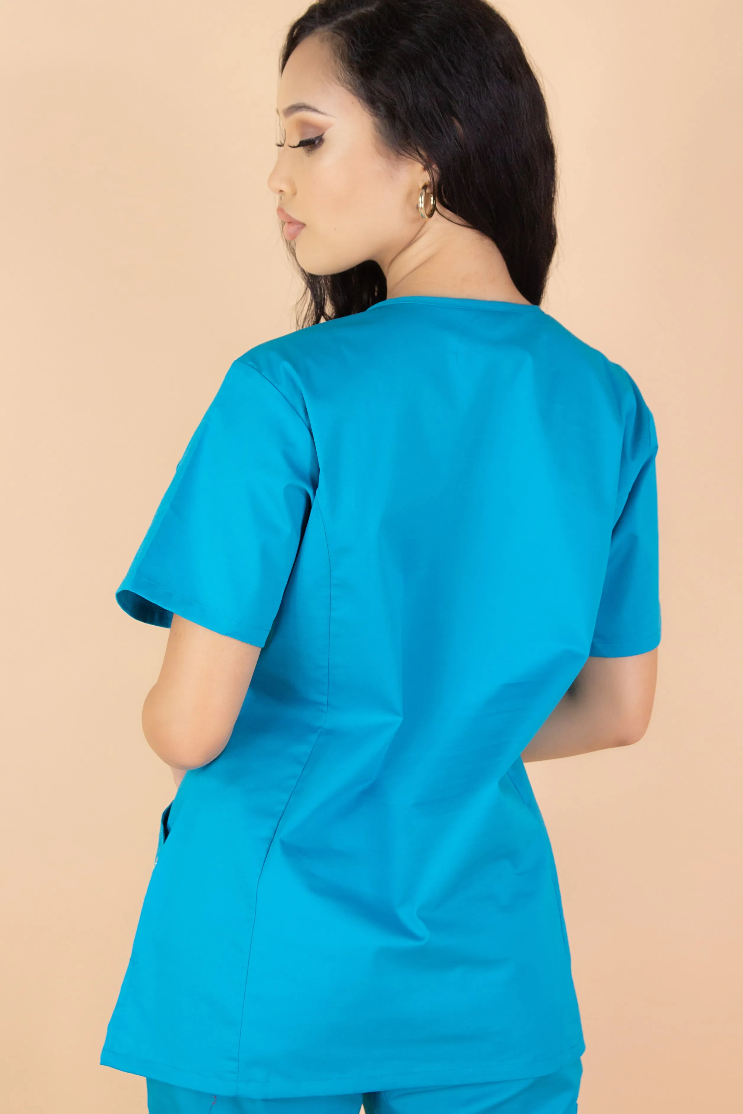 PROUD SCRUB TOP