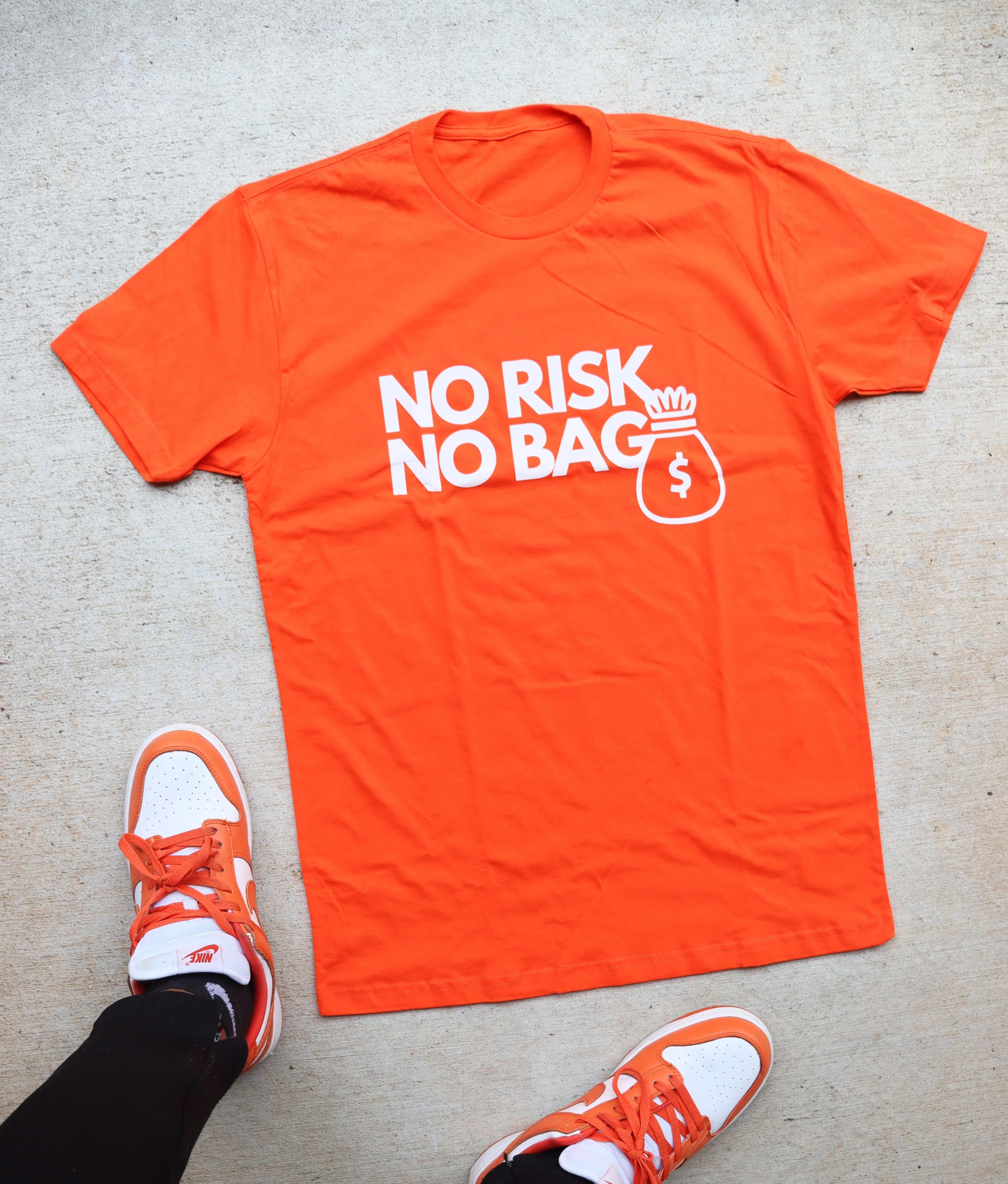 RISKY REWARDS “NO RISK NO BAG” COTTON ORANGE TEE